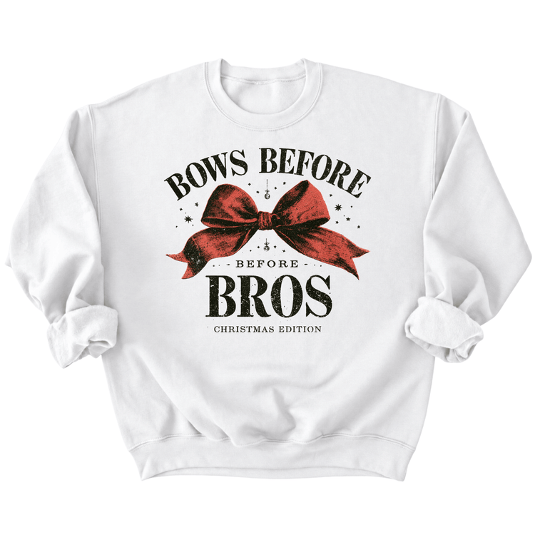 A white sweatshirt with a graphic design featuring a red bow and the text "BOWS BEFORE BROS" and "CHESTNUT EDITION" printed on it.
