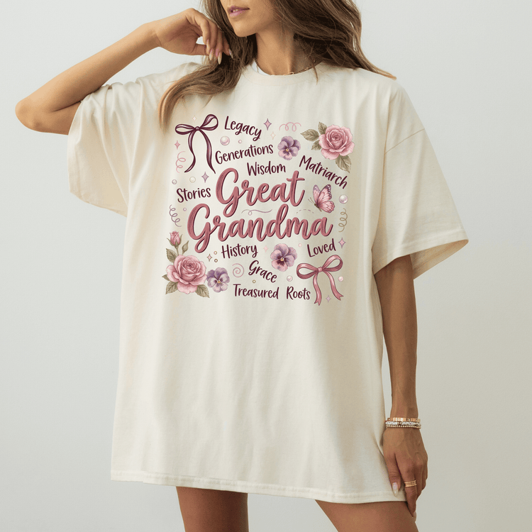 A woman wearing a white t-shirt with a floral design and text printed on it.