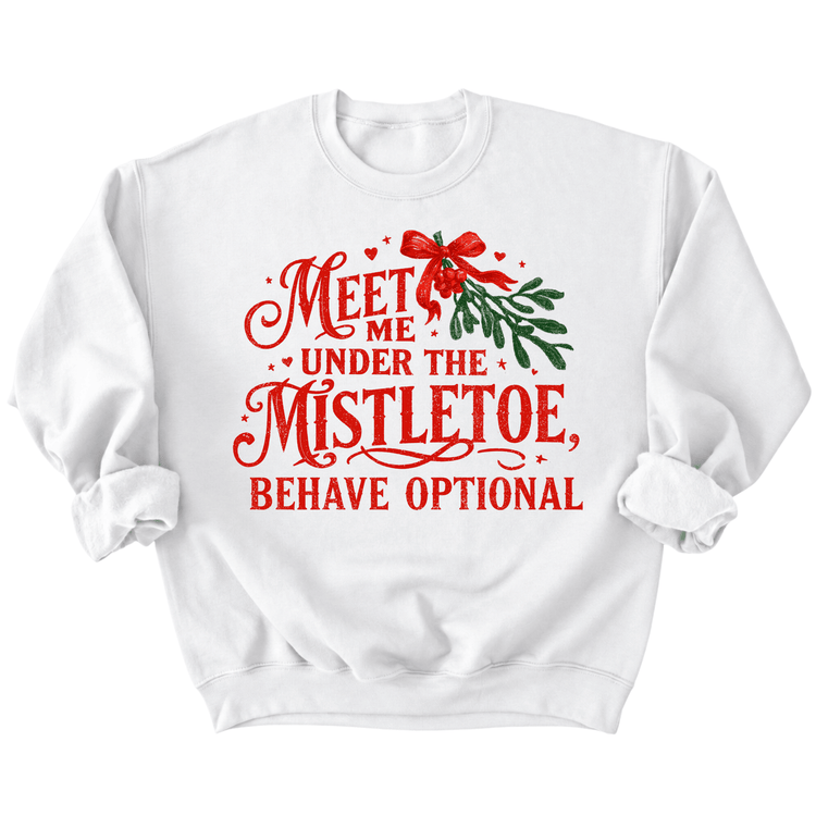 A white sweatshirt with a red and green design that says "Meet me under the mistletoe, behave optional" printed on it.