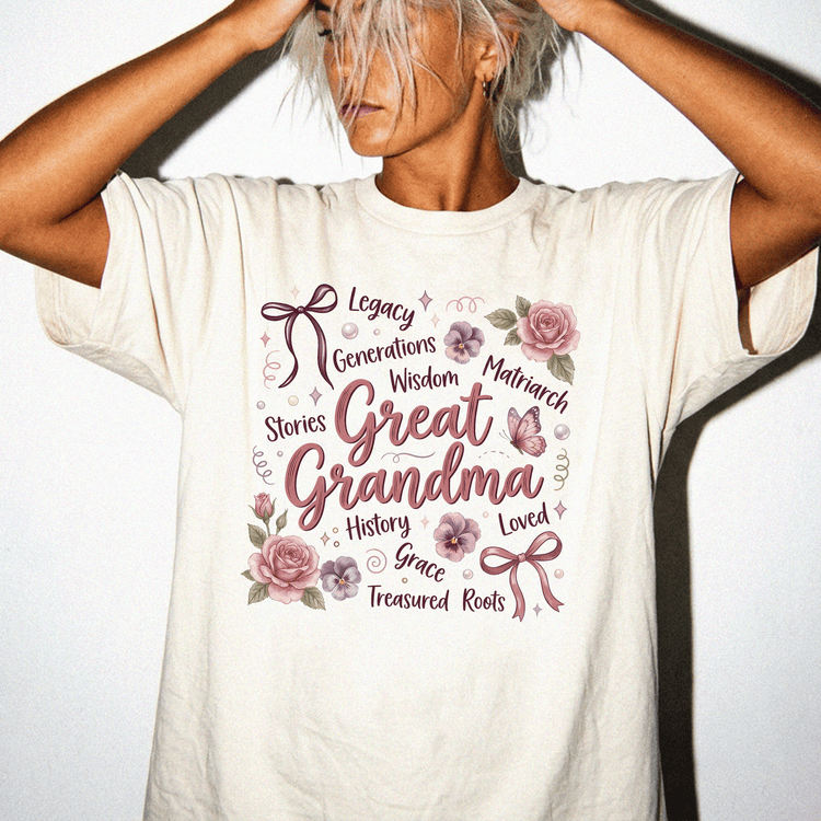 A woman wearing a white t-shirt with a floral design and text printed on it.