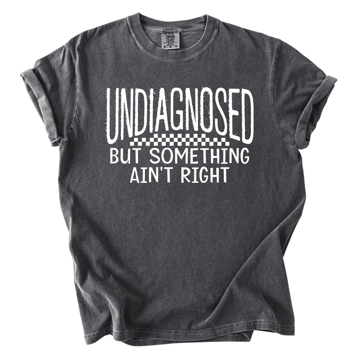 A gray t-shirt with white text that reads "UNDIAGNOSED BUT SOMETHING AIN'T RIGHT".