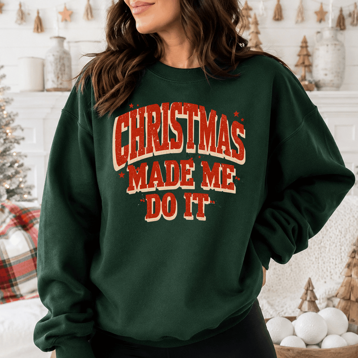 A woman wearing a green sweatshirt with the text "Christmas Made Me Do It" printed on it.