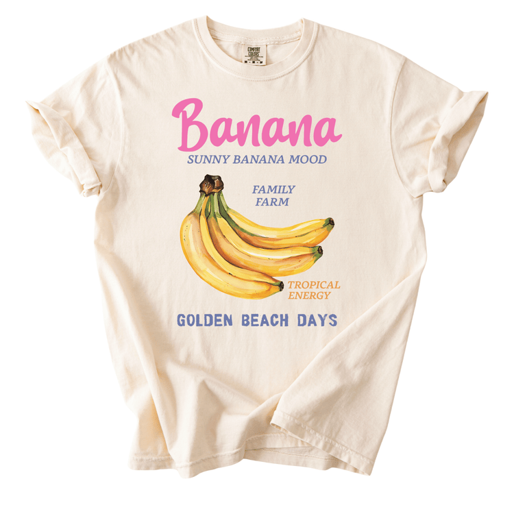 A white t-shirt with a graphic design featuring a bunch of bananas and text related to the fruit.