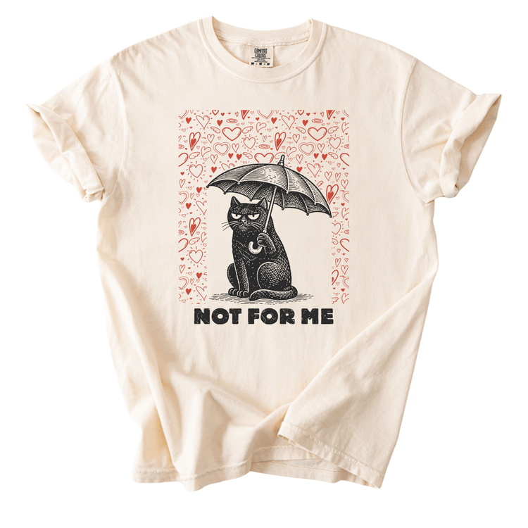 A white t-shirt with a graphic design featuring a black cat sitting under an umbrella, surrounded by hearts. The text below the image says "NOT FOR ME".