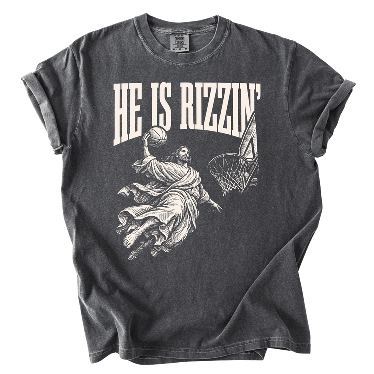 A gray t-shirt with a graphic design depicting a basketball player in mid-air, holding a basketball and jumping towards the hoop.
