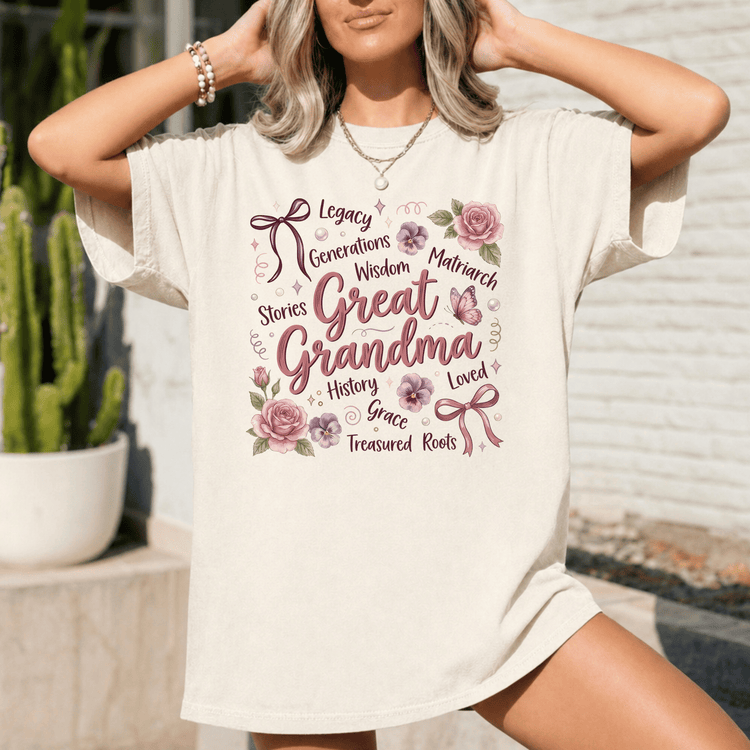 A woman wearing a white t-shirt with a floral design and text printed on it.