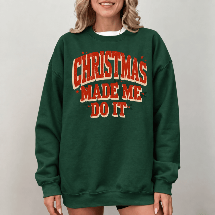 A woman wearing a green sweatshirt with the text "Christmas Made Me Do It" printed on it.
