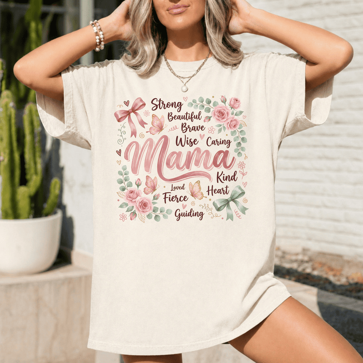 A woman wearing a white t-shirt with a floral design and text printed on it.