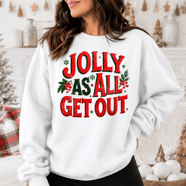 A woman wearing a white sweatshirt with the text "Jolly as all get out" printed on it.