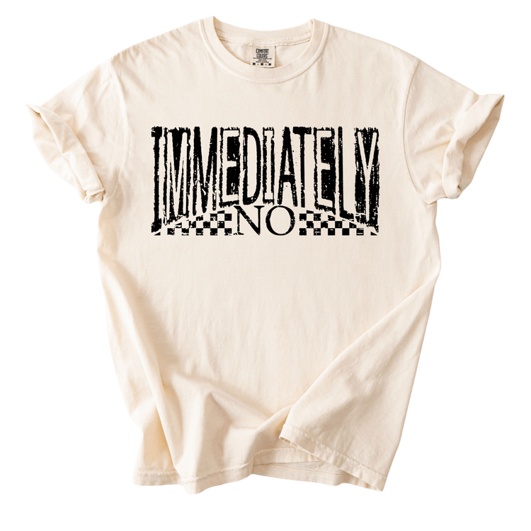 A white t-shirt with the text "IMMEDIATELY NO" printed on it in a distressed, graffiti-style font.