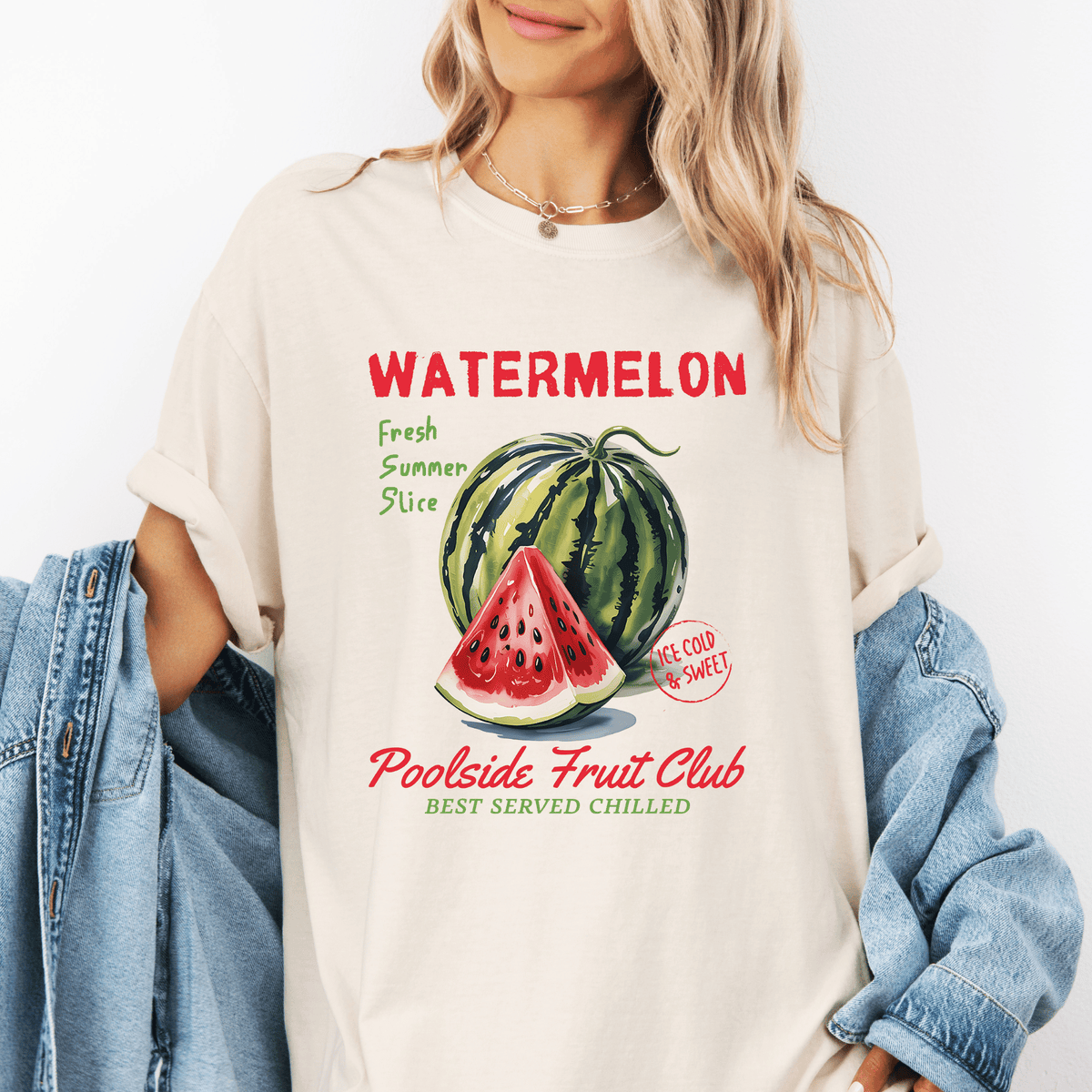 A woman wearing a white t-shirt with a graphic design of a watermelon and text promoting a fruit club.