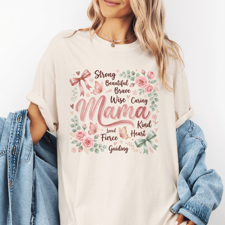 A woman wearing a white t-shirt with a floral design and text printed on it.
