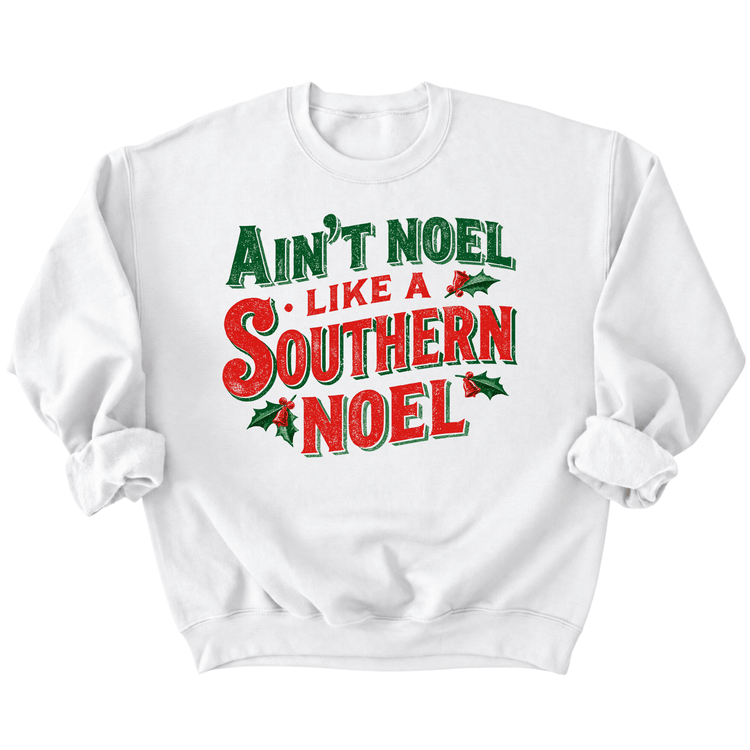 A white sweatshirt with a printed design that says "Ain't Noel Like a Southern Noel" in red and green text.