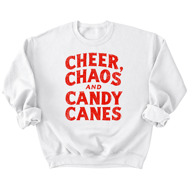 A white sweatshirt with the text "CHEER, CHAOS, AND CANDY CANES" printed on it in red.