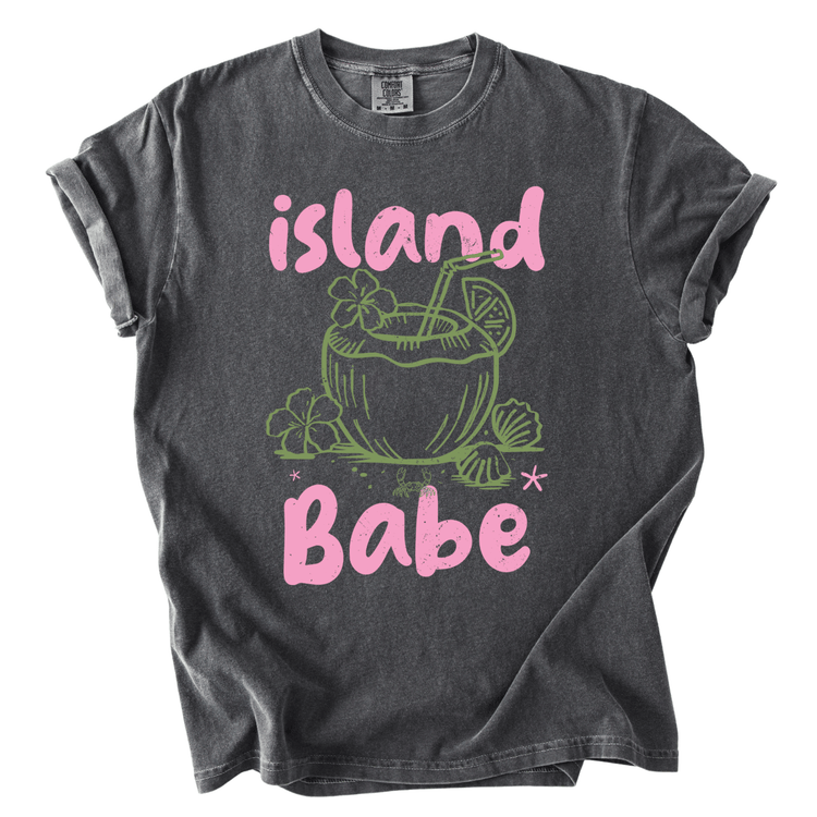 A gray t-shirt with a graphic design featuring a coconut drink and the text "island Babe" in pink and green.