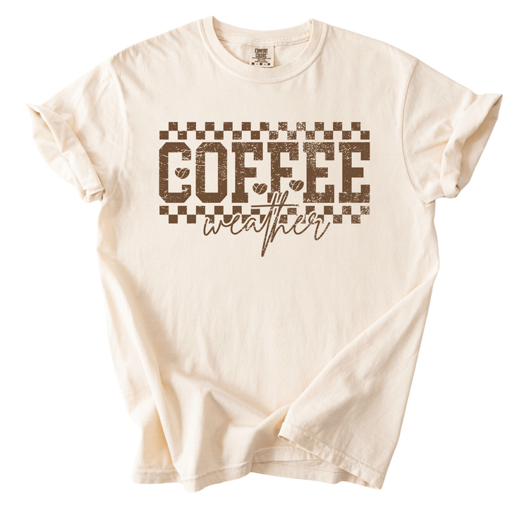 A white t-shirt with the text "COFFEE weather" printed on it in a distressed font.