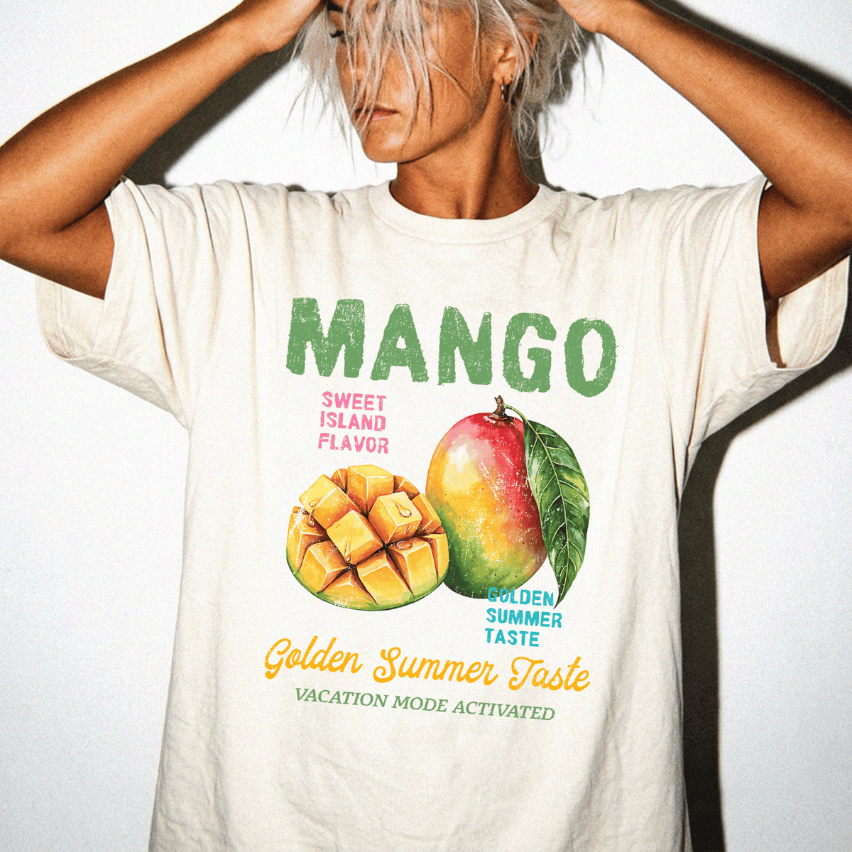 A person wearing a white t-shirt with a graphic design featuring a mango and text promoting a "Golden Summer Taste" vacation mode.