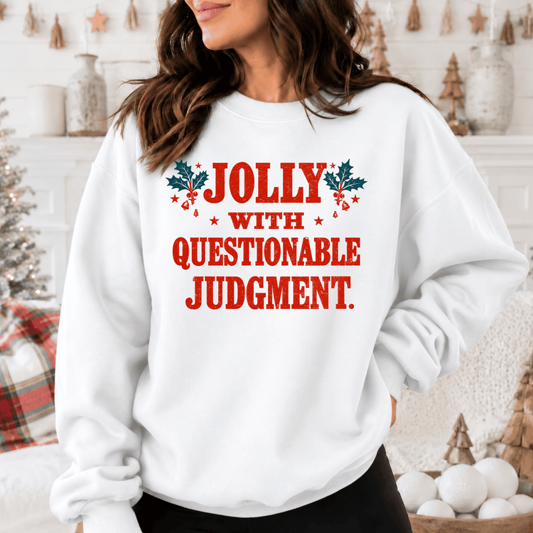 A woman wearing a white sweatshirt with the text "Jolly with Questionable Judgment" printed on it.