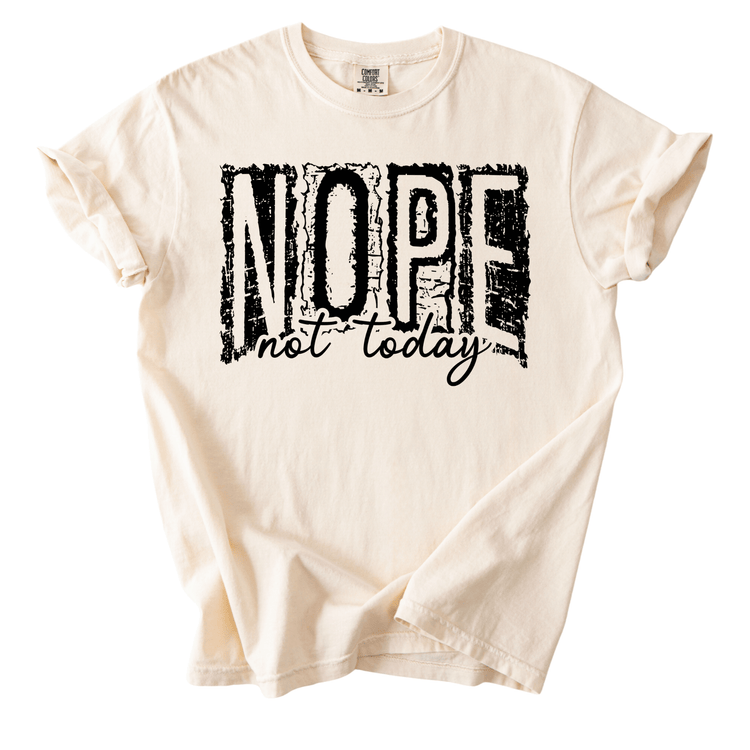 A white t-shirt with the text "NOPE not today" printed on it in a distressed font.
