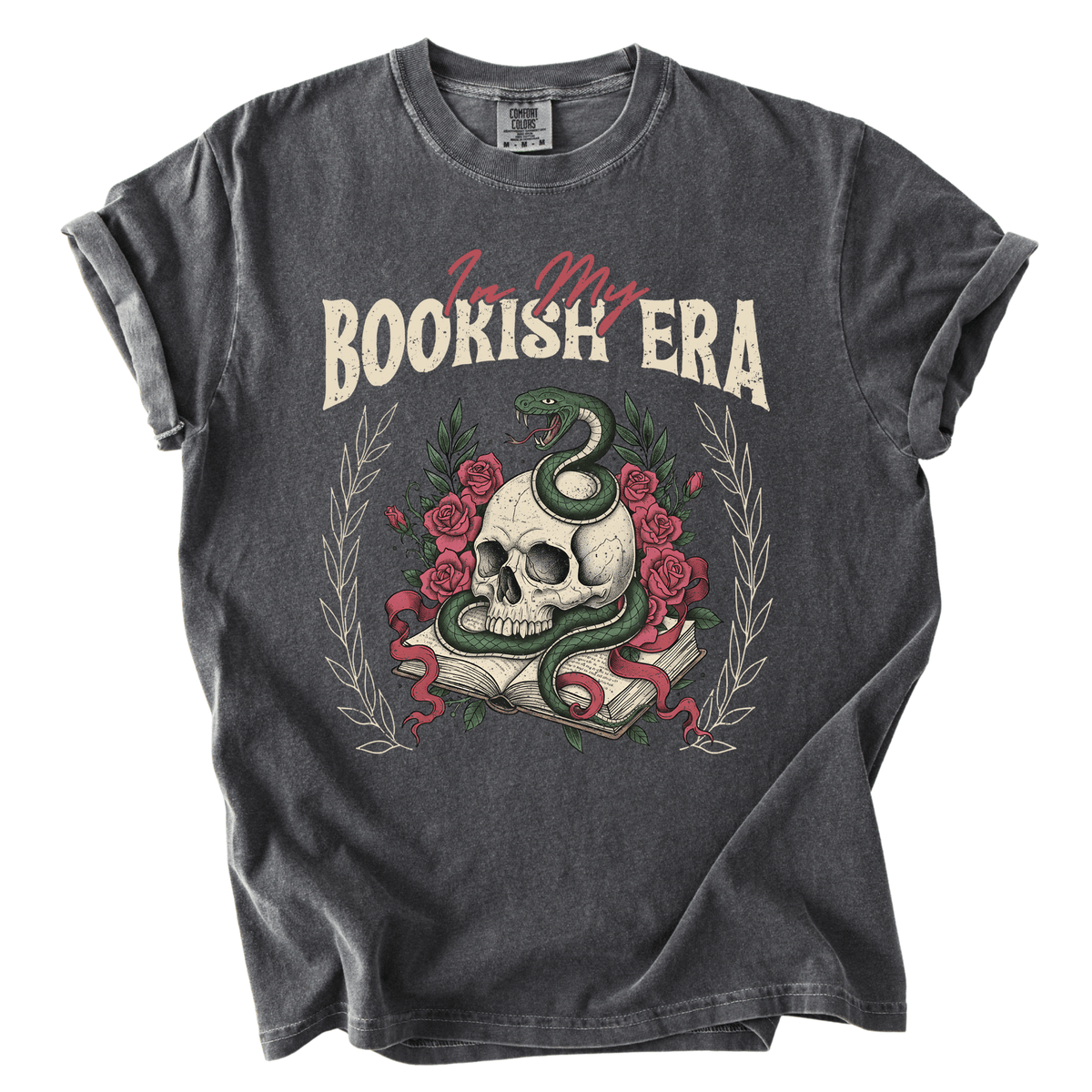 A gray t-shirt with a graphic design featuring a skull, a snake, and roses, along with the text "I'm my BOOKISH ERA" printed on it.
