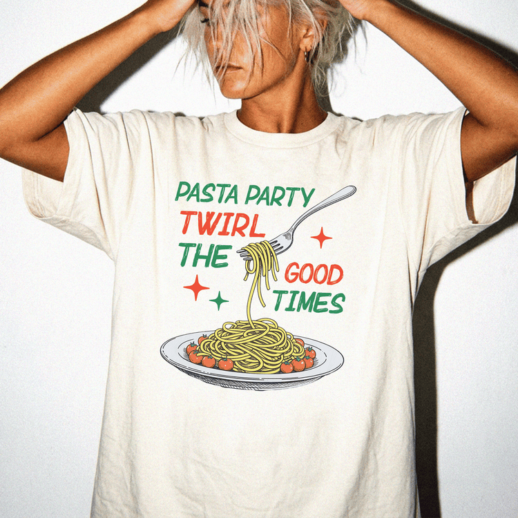 A person wearing a white t-shirt with a graphic design of spaghetti and a fork, along with the text "PASTA PARTY TWILIGHT THE GOOD TIMES".