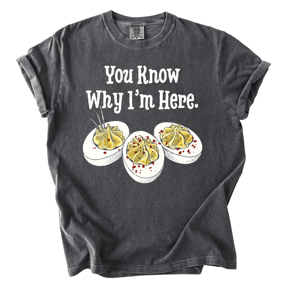 A gray t-shirt with a graphic design featuring three deviled eggs with a humorous caption that reads "You Know Why I'm Here."