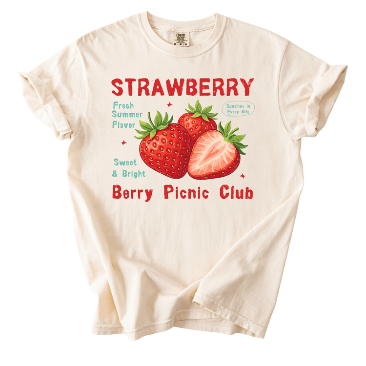 a white t-shirt with a graphic design of strawberries and text promoting a berry picnic club.