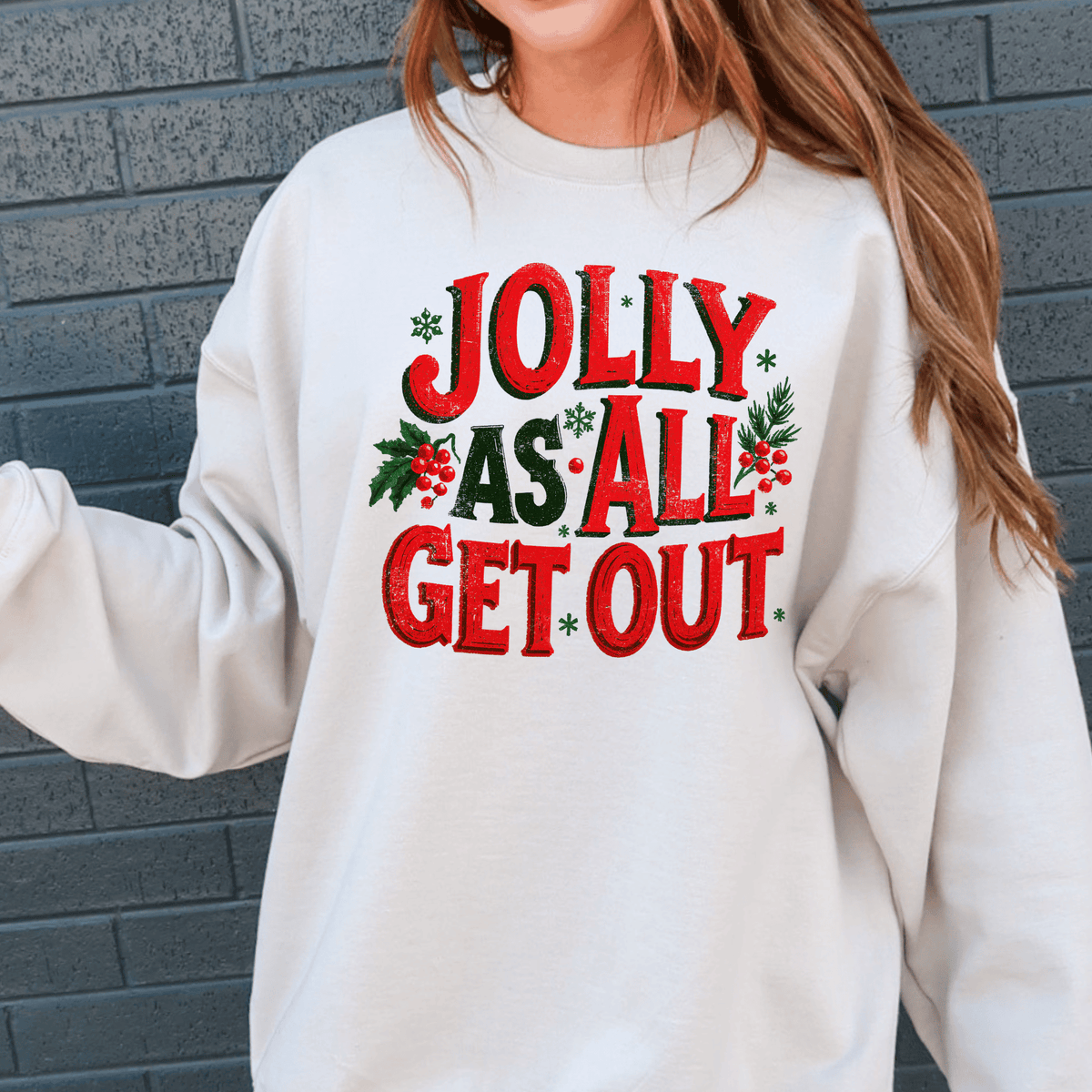 A white sweatshirt with a red and green text design that says "Jolly as all get out".