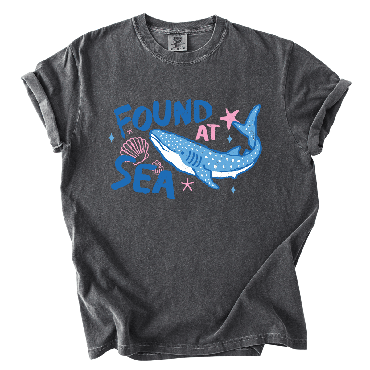 a gray t-shirt with a graphic design depicting a blue whale and various marine elements, including a starfish and seashells.